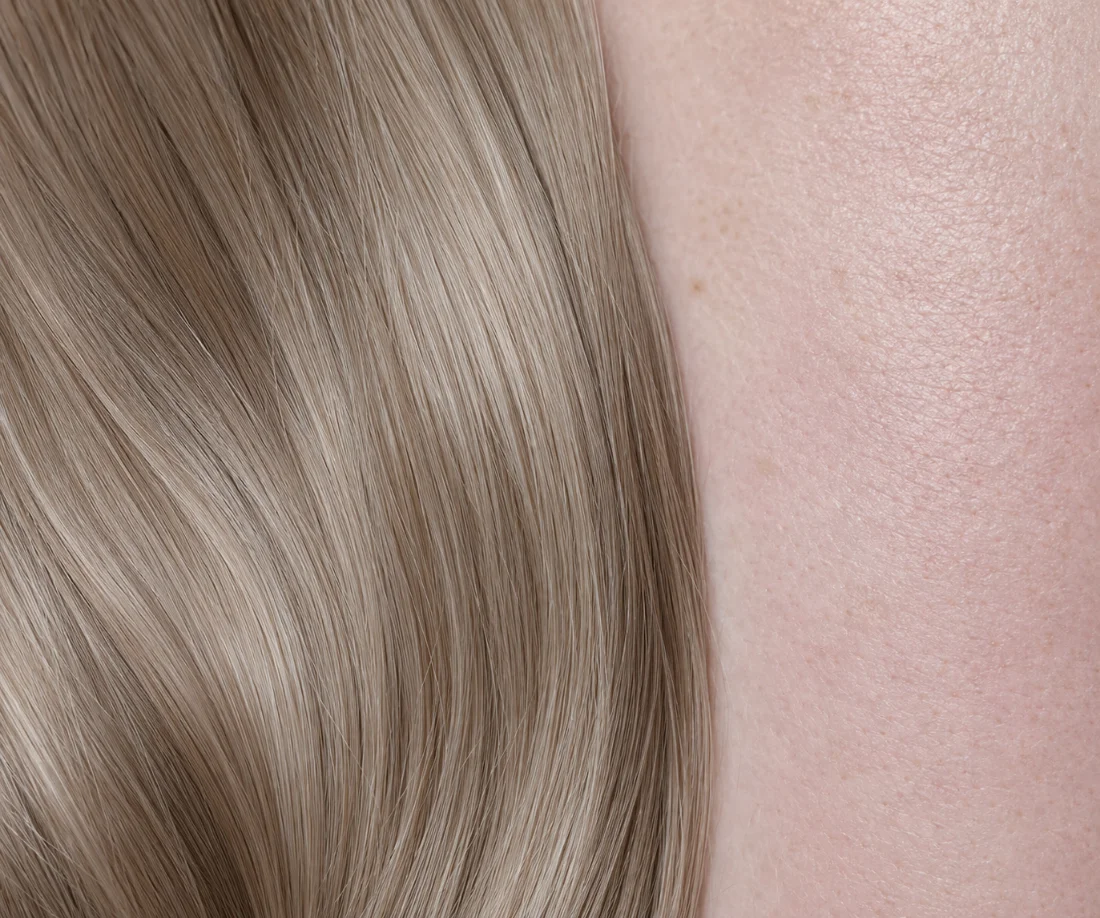 Level 8 ash blonde hair color next to fair, pink-toned cool skin — Poza Salon, Charlotte NC